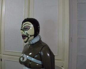 Trailer miss Maskerade Bound in Full Rubber Latex Catsuit