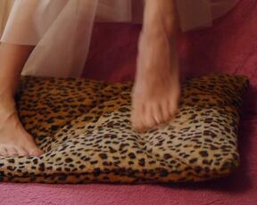 The Ballerina's Legs Stretch & Dance on a Spotted Pillow