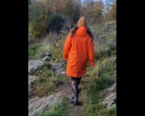 Taking a Stroll in Orange Raincoat and Rubber Boots