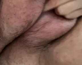 Playing with my hairy, saline filled pussy lips