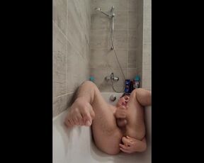 Cute boy sucks and fucks dildo in bathtub