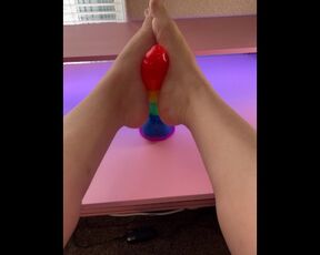 Giving my favorite rainbow cock a teasing footjob