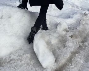 The girl is trying to walk on ice in ballet boots, but her toes are very painful