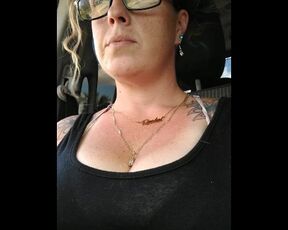 Natural boobs bouncing up and down while I smoke cigerette while getting a ride in car